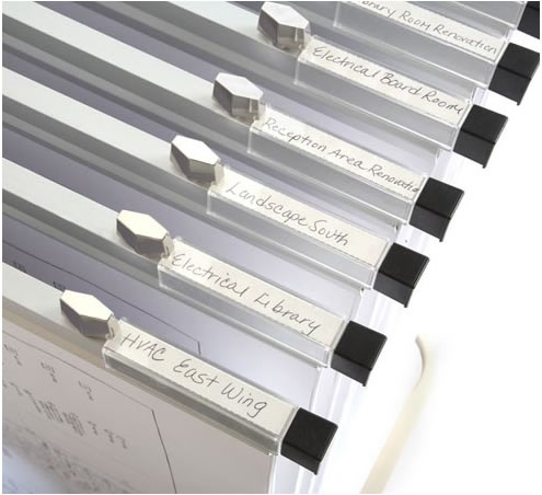 Hanging clamps holding large documents in an orderly fashion.